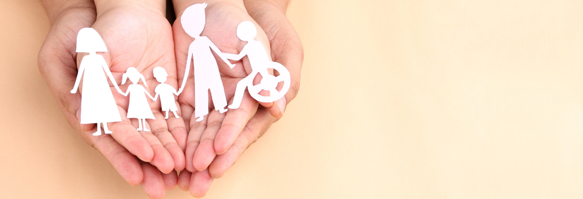 Hands holding paper Cutout of different family members being together.