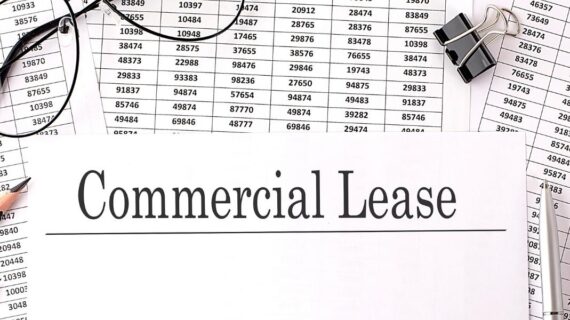 Paper with Commercial Lease on a table with chart