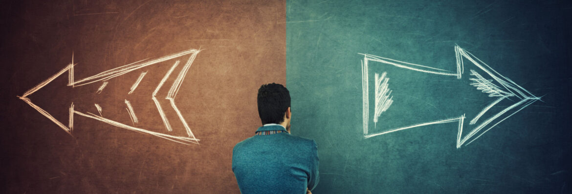 Puzzled businessman and a split blackboard with arrows going in two different ways red and blue side. Correct choice between left and right, failure or success.