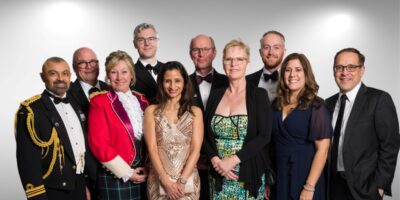 An image of the firm members and their partners, as well as three guests as the 204th Toronto Garrison Officer’s Ball.