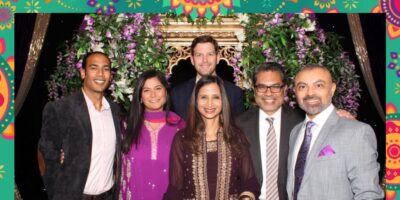 Colleagues posing for a photo at an evening event