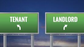 Graphic of a green landlord and tenant sign on sunset background