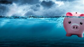 Piggy Bank Drowning In Dark Stormy Waters - Financial Debt Concept