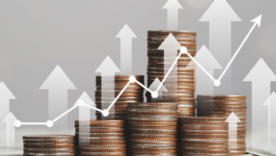 Stack of silver coins with trading chart in financial concepts and financial investment business stock growth