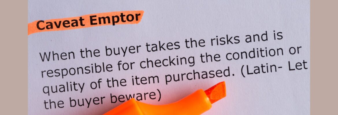 Caveat emptor word highlighted on the white paper