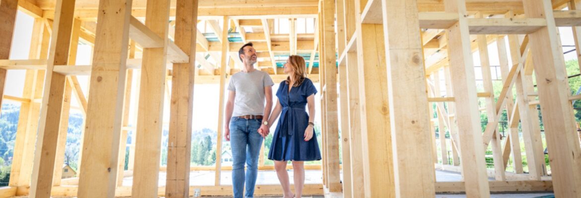 Couple visiting house under construction.