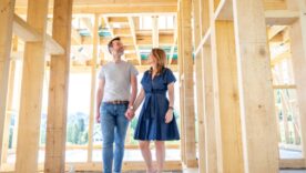 Couple visiting house under construction.