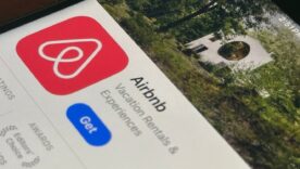 Airbnb app is seen in the App Store on an iPhone. Airbnb, Inc. operates an online marketplace for short and long term homestays and experiences.