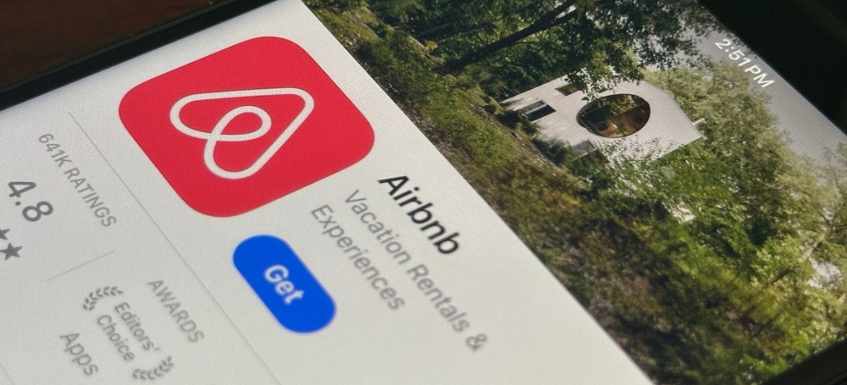 Airbnb app is seen in the App Store on an iPhone. Airbnb, Inc. operates an online marketplace for short and long term homestays and experiences.