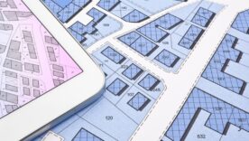 Buildings Permit concept with imaginary cadastral on digital tablet - building activity and construction industry with General Urban Plan.